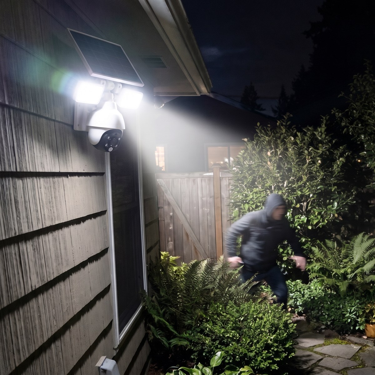 At night the camera spots a person in the garden and switches on the floodlights